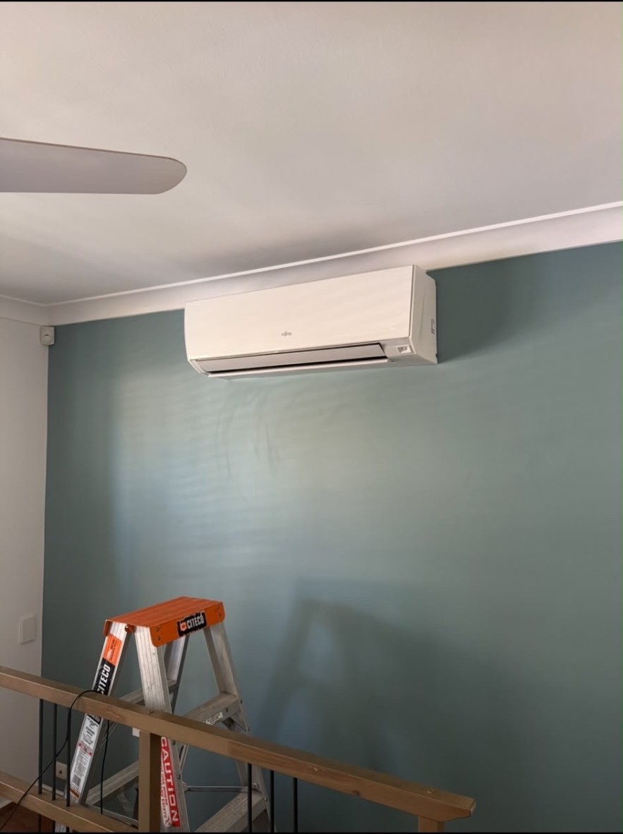 Completed wall-mounted split system air conditioner installation in a Sydney home